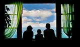 family on vacation, silhouettes on sky background
