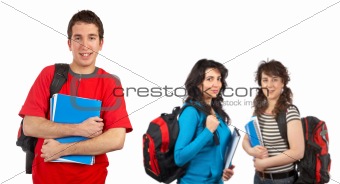Three students with books and backpacks