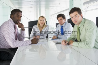 Four businesspeople in a boardroom