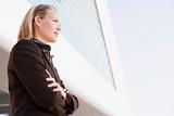 Businesswoman standing outdoors by building