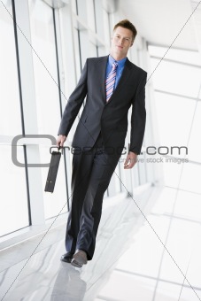 Businessman walking in corridor
