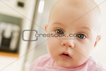 Baby's face in kitchen