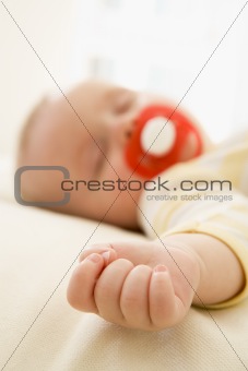 Baby lying indoors sleeping