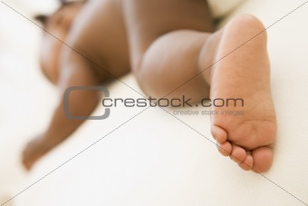 Baby sleeping with focus on foot