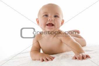 Baby lying down smiling