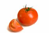 Fresh tomato with slice on white ground
