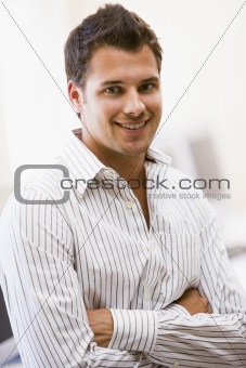 Man standing in computer room smiling