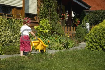little girl having fun in garden
