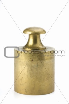 brass weight on white background