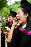Beautiful Asian university graduate celebrating her success.