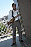 Black African Amercian Man Outdoors With a Saxophone