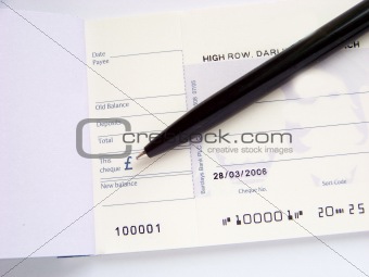 cheque book and pen