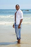 African Amercian Male Standing in the Ocean Surf
