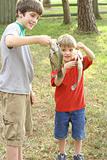 shot of two young boys showing off their catch