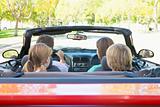 Family in convertible car