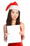 Young Asian Mrs. Santa with blank paper template