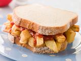 Chip Sandwich on White Bread with Tomato Ketchup