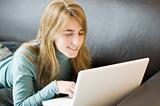 Close-up of a Young Woman Using a Laptop at Home