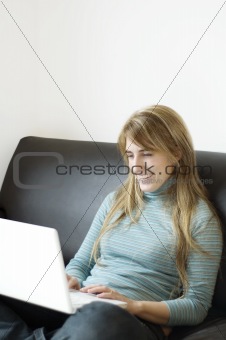 Young Woman Using Laptop at Home