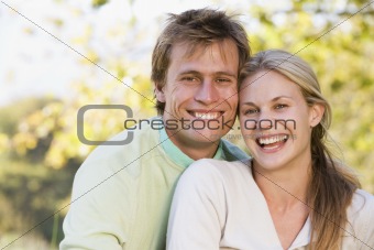 Couple outdoors smiling