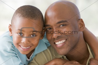 Man and young boy embracing and smiling
