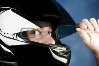 Wide-eyed man in a motorcycle helmet