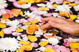 Woman touching flower petals 