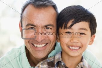 Man and young boy smiling