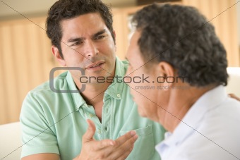 Two men in living room arguing