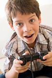 Young boy holding video game controller