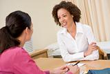 Woman in doctor's office smiling