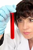 Closeup of woman analysing test tube
