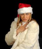Attractive christmas girl with fur and long blond hair