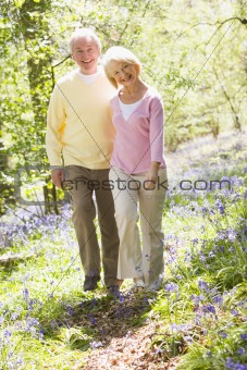 Couple walking outdoors smiling