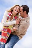 Couple standing outdoors smiling