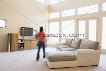Woman walking through living room