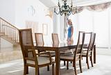 Woman in dining room smiling