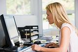 Woman in home office with computer