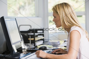 Woman in home office with computer