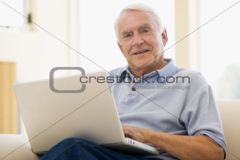 senior,man,laptop,computer,at home,sofa,browsing,surfing,interne
