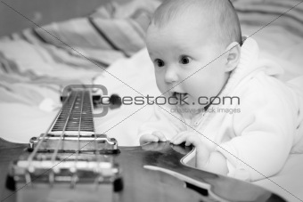 Infant and the bass guitar