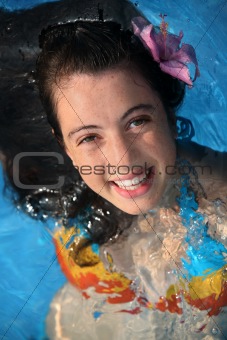 Happy girl in a pool