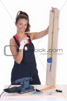 woman carpenter with wooden plank 