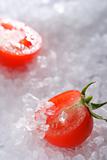 halved cherry tomato on sea rock salt