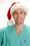 posing handsome doctor with santa cap