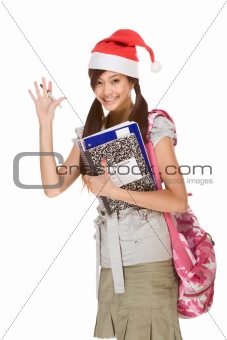 Asian student in Christmas hat gesturing greets