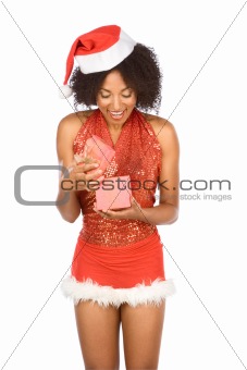 Ethnic woman surprised with Christmas present