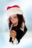 lady wearing christmas hat and singing into microphone
