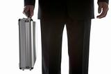 Businessman Holding Sturdy Silver Suitcase