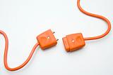 Two Orange Electric Plugs